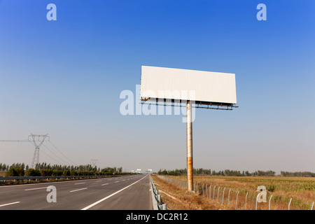 Blank billboard by the highway Stock Photo