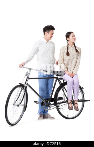 Retro couple with an old-fashioned bicycle Stock Photo