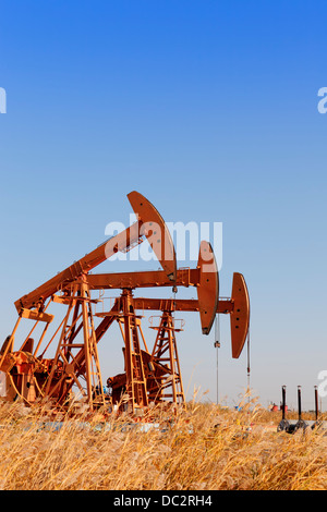 Steel oil pump jacks  (HDR) Stock Photo