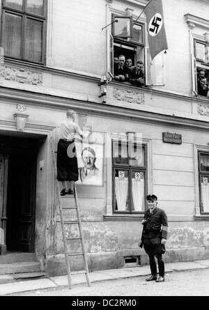 Occupation of Czecho-Slovakion territories (here Podhradi u Ase in the Czech Republik) by the German Wehrmacht after the Munich Agreement of 30 September 1938 - at the communal office of Prohradi (German: Neuberg am Asch) swasticas and an iamge of Hitler are attached in October 1938. Image is part of the Nazi Propaganda! effort. Fotoarchiv für Zeitgeschichte Stock Photo