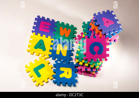 Colourful interlocking foam squares with letters and numbers Stock Photo