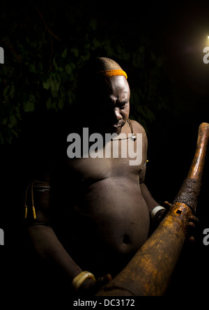 Bodi Tribe Man With An Elephant Tusk During The Kael Ceremony, Hana Mursi, Omo Valley, Ethiopia Stock Photo