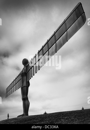 A large steel statue created by artist Adam Gormley located near Gateshead in the north of England Stock Photo