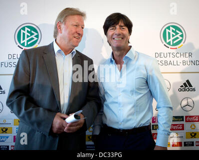 Frankfurt Main, Germany. 08th Aug, 2013. Head coach of the German national soccer team Joachim Loew (R) and the new U21-national head coach Horst Hrubesch attend a press conference at the headquarters of the German Football Association in Frankfurt Main, Germany, 08 August 2013. Loew announced the squad for the international match against Paraguay. Photo: FRANK RUMPENHORST/dpa/Alamy Live News Stock Photo