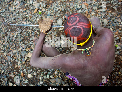 Bodi Tribe Blowing In A Local Trumpet For Kael Ceremony, Hana Mursi, Omo Valley, Ethiopia Stock Photo