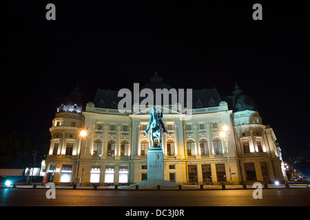 The Central University Library is located in Bucharest center, with statue of Carol I, first king of Romania in front. Stock Photo