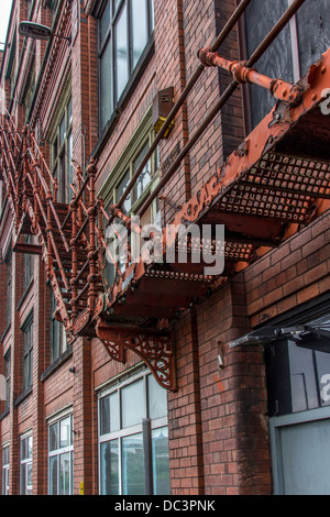 Fire escape up the side of an old warehouse Stock Photo