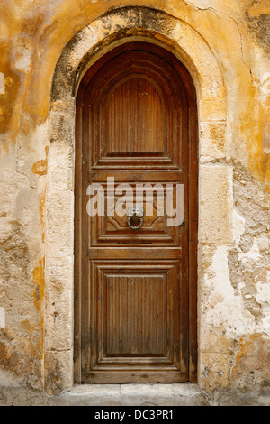 Old wooden door in city of Rethymno, Crete, Greece Stock Photo
