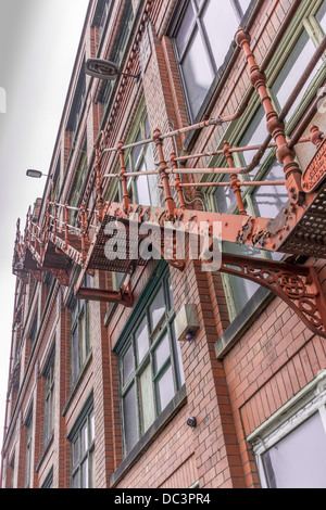 Fire escape up the side of an old warehouse Stock Photo