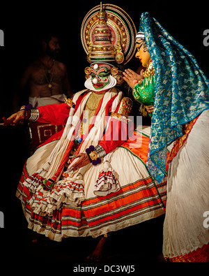 Dancers in traditional costumes perform the south Indian dance/drama of Kathakali in Kerala, India. Stock Photo