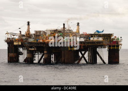 Offshore oil rig Petrobras VIII with helicopter landed/landing on deck, offshore Rio de Janeiro, campos Basin, Brazil Stock Photo