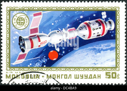 MONGOLIA - CIRCA 1975: A postage stamp printed in Mongolia shows the docking of spacecraft Soyuz - Apollo, circa 1975 Stock Photo