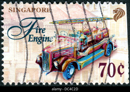 SINGAPORE - CIRCA 1997: A stamp printed in Singapore, shows fire engine, circa 1997 Stock Photo