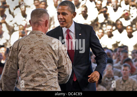 US President Barack Obama greets Marine Corps Maj. Gen. Lawrence D. Nicholson before delivering a speech thanking the Marines for their service to the nation August 7, 2013 in Camp Pendleton, CA. Stock Photo