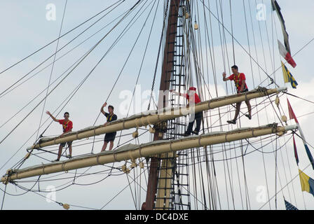 Chicago, Illinois, USA. 7th Aug, 2013. Tall ships arrive in Chicago. Crowd gather at Navy Pier to watch the parade of boats as a downpour deluged the crowd and boats, forcing many of the boats to douse their sails. (Credit Image: © Karen I. Hirsch/ZUMA Wire) Stock Photo