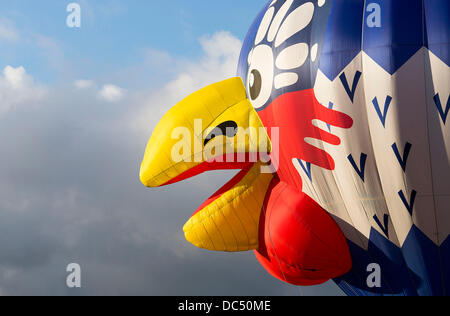 Bristol, UK. 09th Aug, 2013. A hot air balloon shaped like a cockerel waits to take off at the Bristol International Balloon Fiesta. The annual event attracts thousands of spectators to watch balloonists from all over the world take to the skies above the city. 9 August 2013 Credit:  Adam Gasson/Alamy Live News Stock Photo