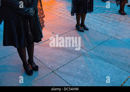 Women's legs during Holy Week procession. Madrid, Spain. Stock Photo