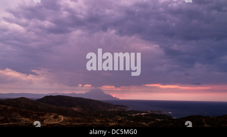 Stormy sky and sunrise at holy mountain Athos Stock Photo