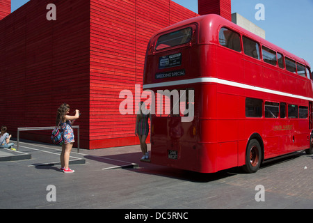 A wedding special red Routemaster parked outside the National Theatre's temporary space The Shed Theatre on the South Bnak, London, UK. The South Bank is a significant arts and entertainment district, and home to an endless list of activities for Londoners, visitors and tourists alike. Stock Photo