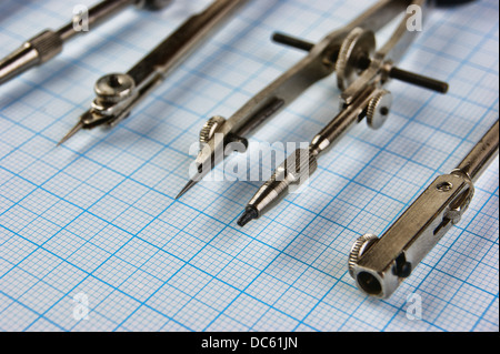 Old drawing tools on graph paper Stock Photo