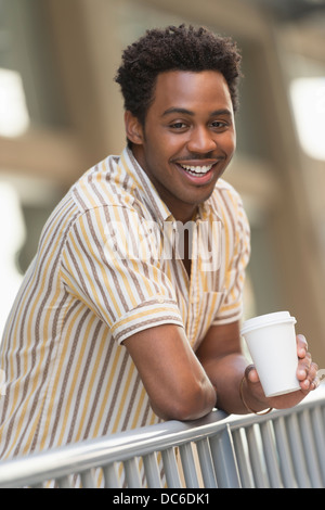 Man drinking coffee outdoors Stock Photo