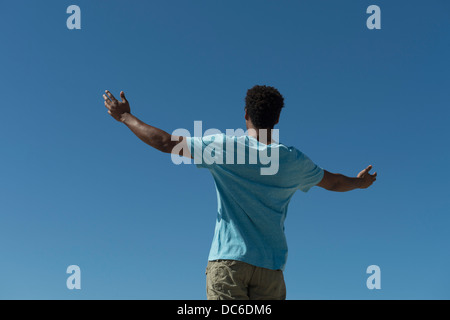 Happy man against clear sky Stock Photo