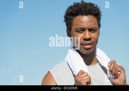 Athlete with towel on neck Stock Photo