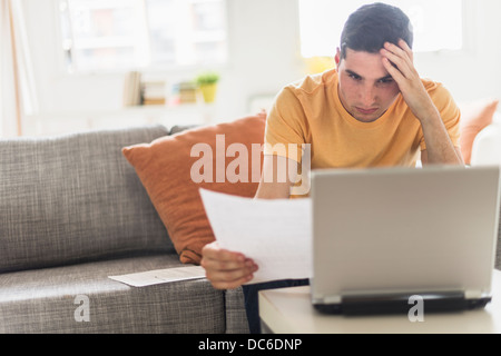 Man using laptop at home Stock Photo