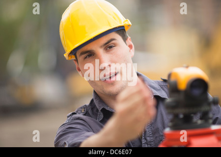 Engineer using theodolite Stock Photo