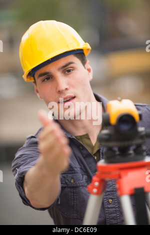 Engineer using theodolite Stock Photo