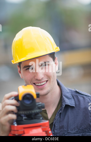 Engineer using theodolite Stock Photo