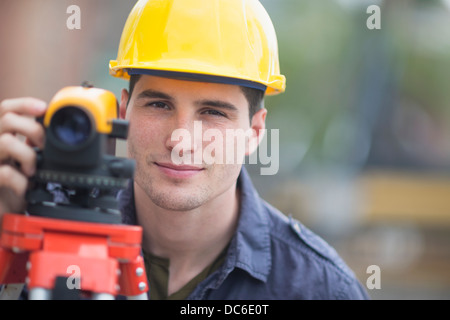 Engineer using theodolite Stock Photo