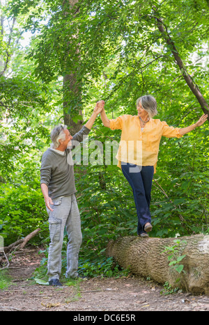 USA, New York State, New York City, Central Park, Senior couple hiking in forest Stock Photo