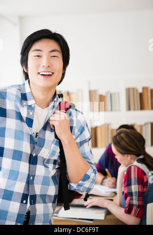 Portrait of cheerful student in library Stock Photo