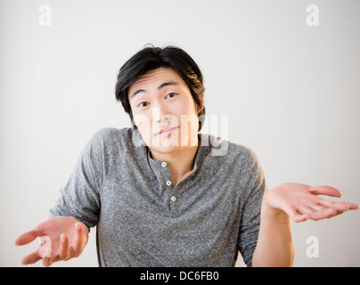 Portrait of confused young man Stock Photo