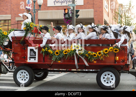 August 2, 2013, Saratoga Springs, NY.  Participants parade down Broadway in the annual 'Floral Fete Promenade.' Stock Photo