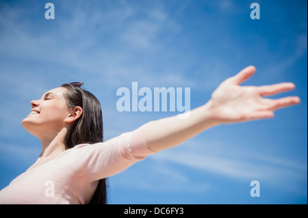 Young woman enjoying sunny weather Stock Photo