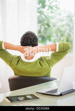 Rear view of man taking break from work Stock Photo