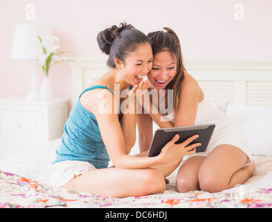 Two women using digital tablet Stock Photo