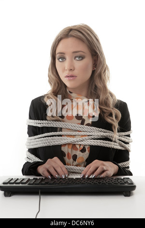 Business woman tires up to her desk unable to type Stock Photo