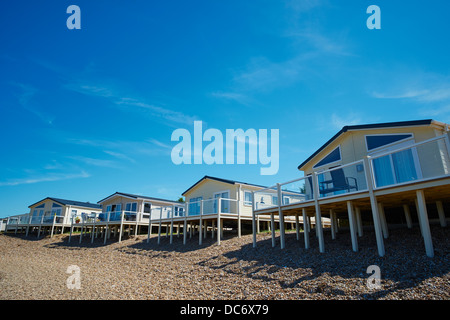 Static Holiday Caravans by a pool Romney Sands New Romney Kent UK Stock Photo