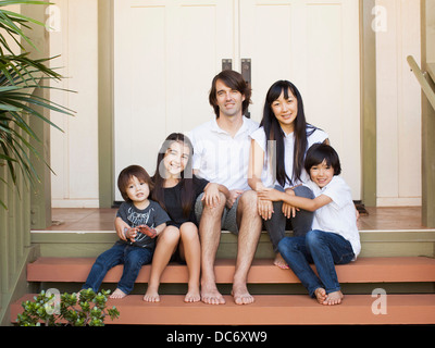 Portrait of family with three kids (2-3, 8-9) Stock Photo