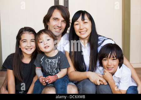 Portrait of family with three kids (2-3, 8-9) Stock Photo