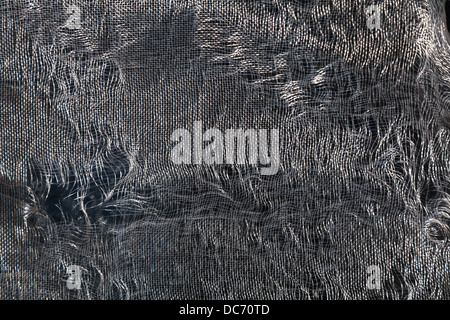 A piece of damaged wire screening used in windows or screen doors. Stock Photo