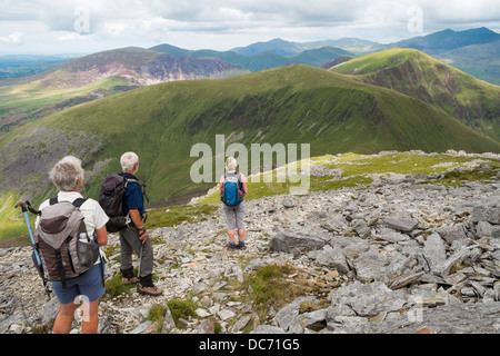 Walkers looking northeast from Craig Cwm Silyn on Nantlle ridge walk in mountains of Snowdonia National Park, North Wales, UK Stock Photo