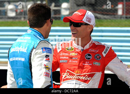 Watkins Glen, New York, USA. 10th Aug, 2013. August 10, 2013: NASCARSprint Cup Series driver Kevin Harvick (right) talks with driver Aric Almirola (left) during qualifying for the NASCAR Sprint Cup Series Cheez-It 355 at The Glen at Watkins Glen International in Watkins Glen, New York. Credit:  csm/Alamy Live News Stock Photo