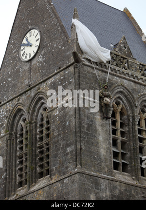 Memorial to John Steele on the spire of Sainte Mere Eglise church, Normandy, France. Stock Photo