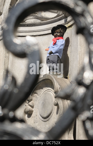 Manneken Pis with beret and baguette in French National Day on 14 July 2012 seen through decorating fence Stock Photo