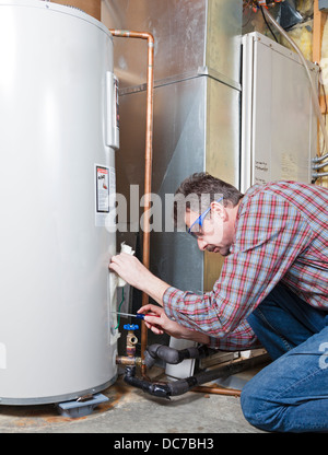 Water heater maintenance Stock Photo