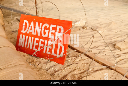 Danger minefield sign in a Desert landscape. Stock Photo